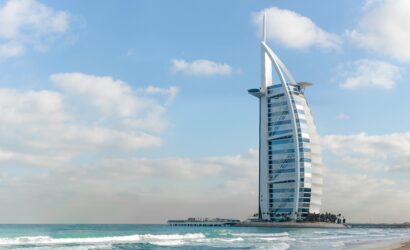 Home Stunning view of Burj Al Arab with a serene beach setting in Dubai, UAE.