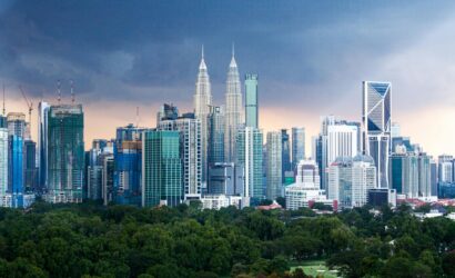 Home Breathtaking Kuala Lumpur skyline featuring the iconic Petronas Twin Towers amidst modern skyscrapers.